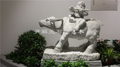 Shepherd riding a cow